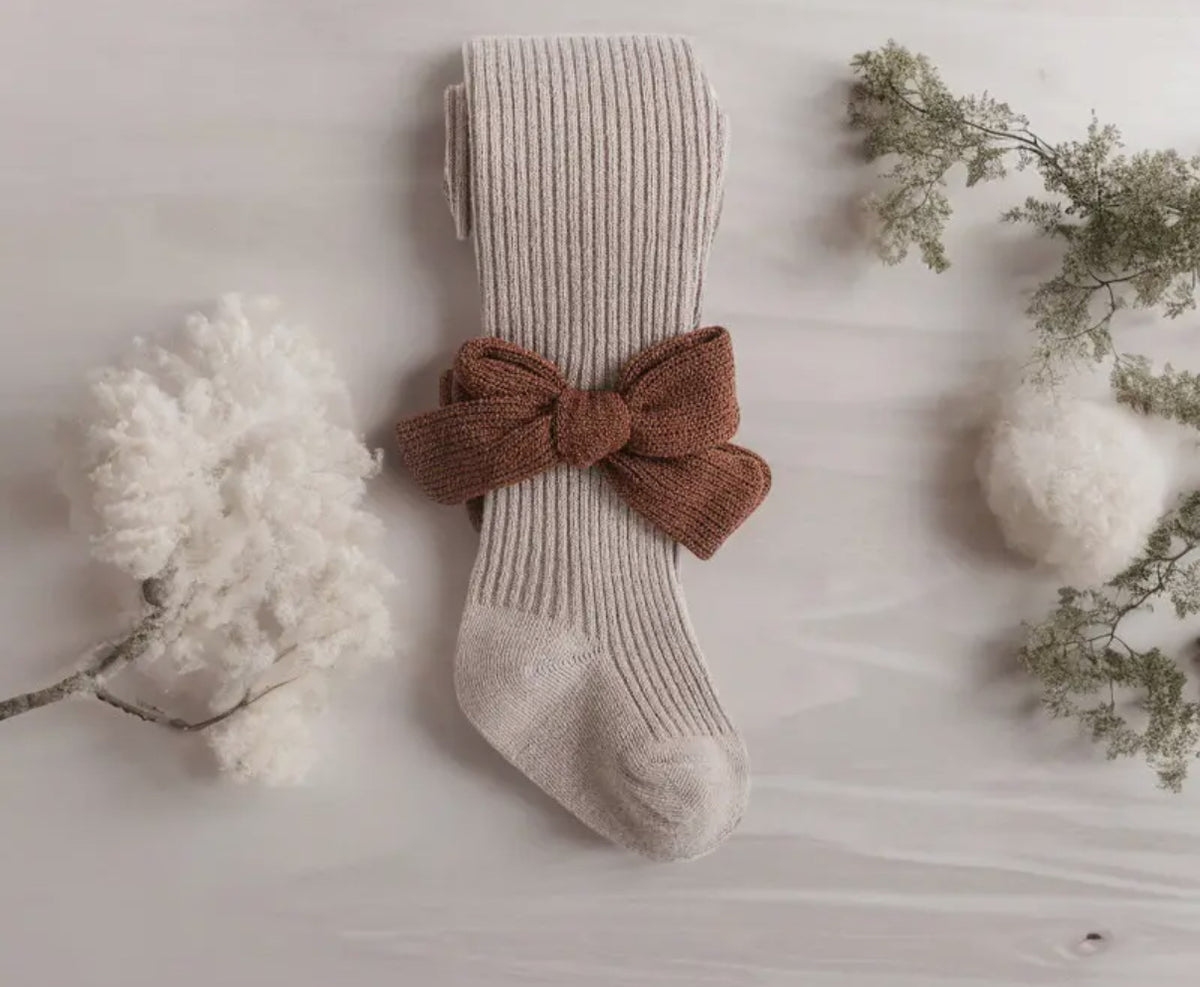 Collant beige con fiocco