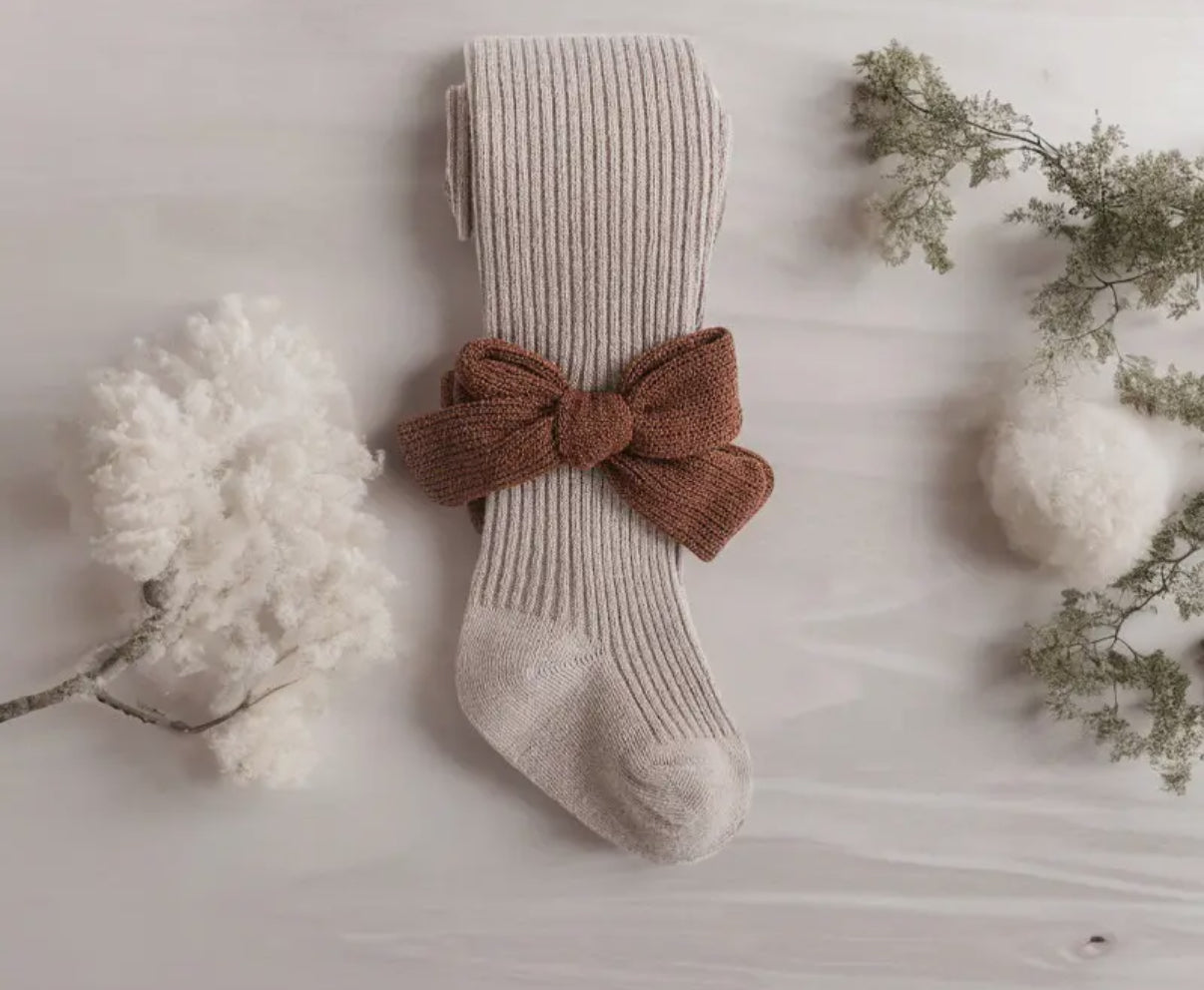 Collant beige con fiocco